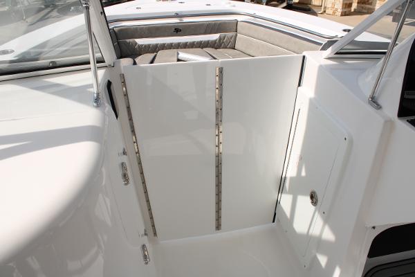 Slide: The Image of 2024 Sea Pro 240 boat interior with seating and storage compartments. - 27