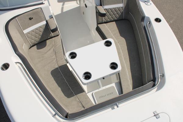 Slide: The Image of 2024 Sea Pro 240 boat interior with cushioned seating and table. - 28