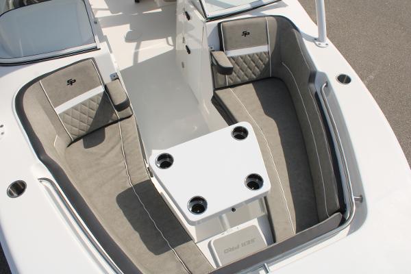 Slide: The Image of 2024 Sea Pro 240 boat interior with cushioned seating and center table. - 29