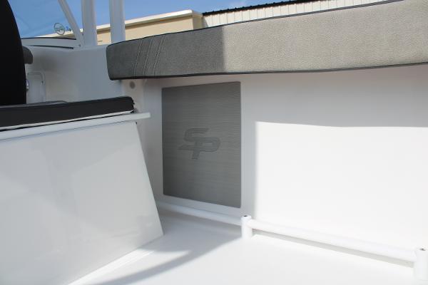 Slide: The Image of 2024 Sea Pro 240 boat interior with seating and logo. - 31