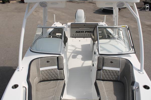 Slide: The Image of 2024 Sea Pro 240 boat interior with dual consoles and cushioned seating. - 7