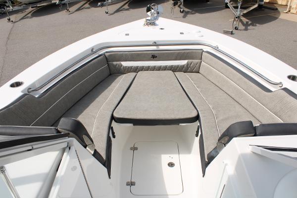 Slide: The Image of 2024 Sea Pro 240 boat with spacious cushioned seating area. - 9