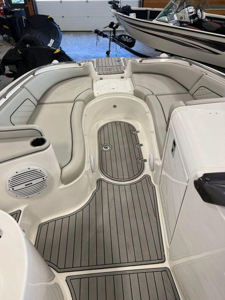 Slide: The Image of 2022 Sea Pro Citation 2400 boat interior with cushioned seating and non-slip flooring. - 4