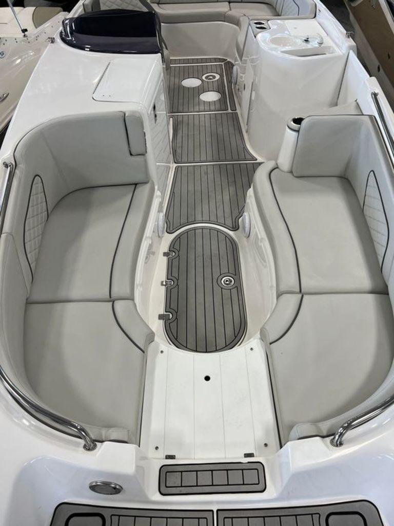 Slide: The Image of 2022 Sea Pro Citation 2400 boat interior with cushioned seating and non-slip flooring. - 7