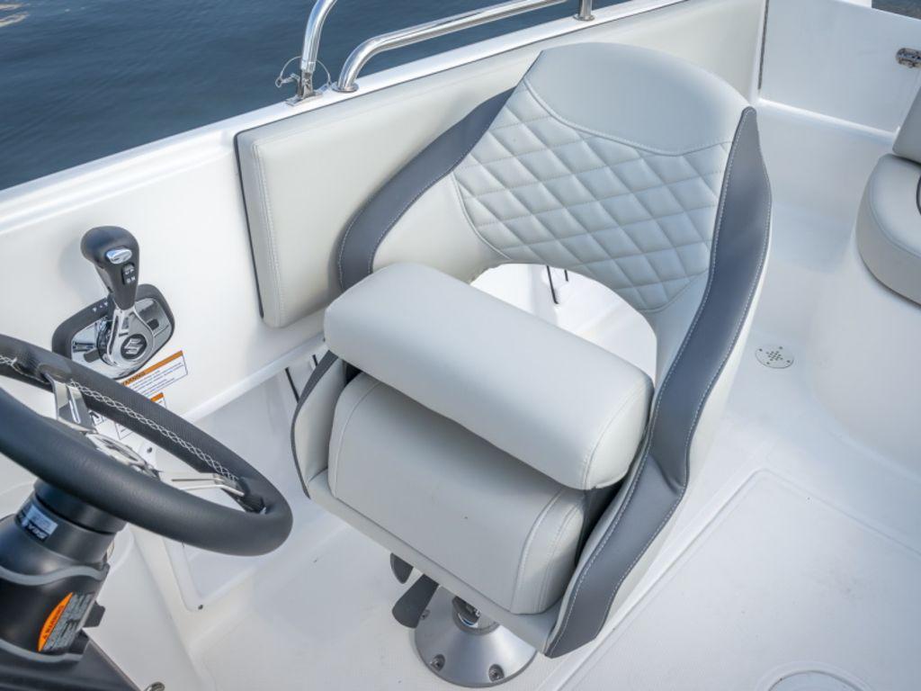 Slide: The Image of Captain's chair and controls on a 2022 Sea Pro Citation 2400 boat. - 8