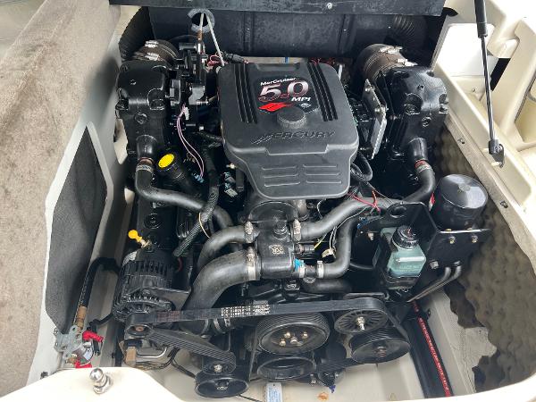 Slide: The Image of Engine compartment of a 2004 Sea Ray 200 Select boat, featuring a MerCruiser 5.0 MPI engine. - 10