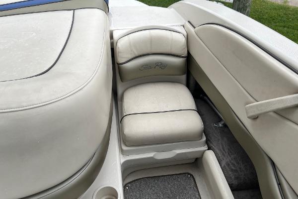 Slide: The Image of 2004 Sea Ray 200 Select boat interior seating, beige upholstery, close-up view. - 15