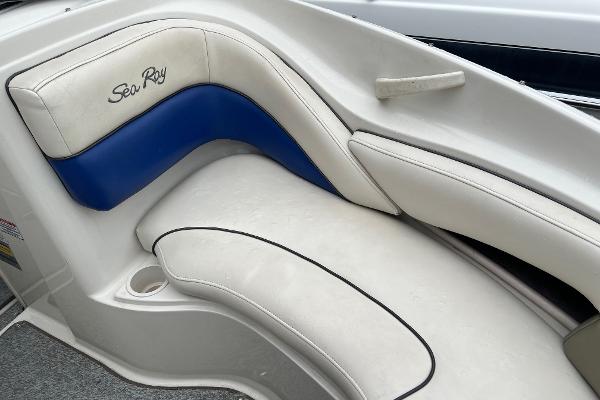 Slide: The Image of 2004 Sea Ray 200 Select boat interior with white and blue seating. - 19