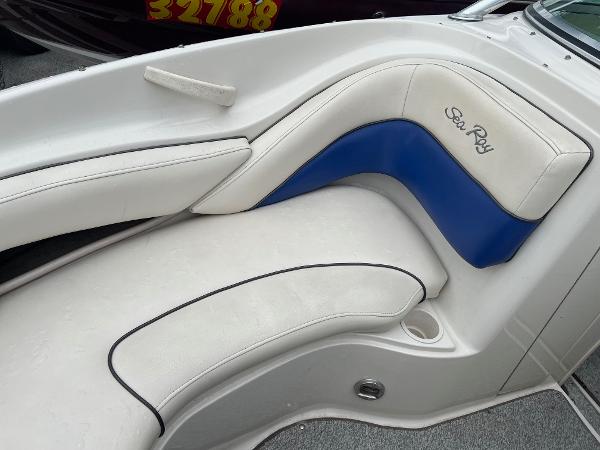 Slide: The Image of 2004 Sea Ray 200 Select boat interior with white and blue seating. - 3