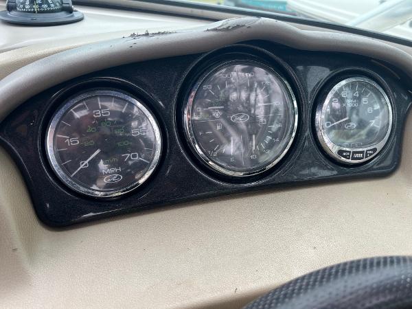 Slide: The Image of Dashboard gauges of a 2004 Sea Ray 200 Select boat, showing speedometer and tachometer. - 7
