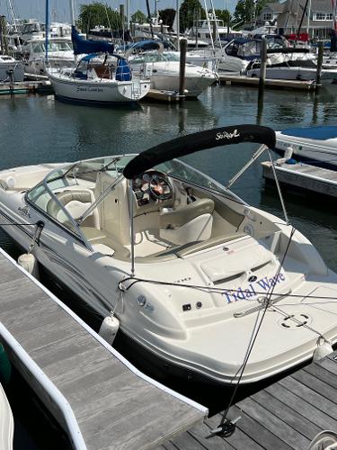 Slide: The Image of 2006 Sea Ray 200 Sundeck boat docked in a marina. - 0