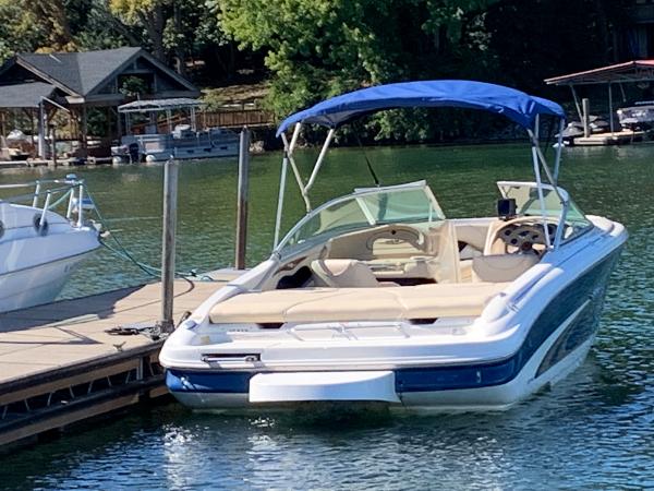 Slide: The Image of 2000 Sea Ray 210 Bow Rider docked on a sunny day. - 4