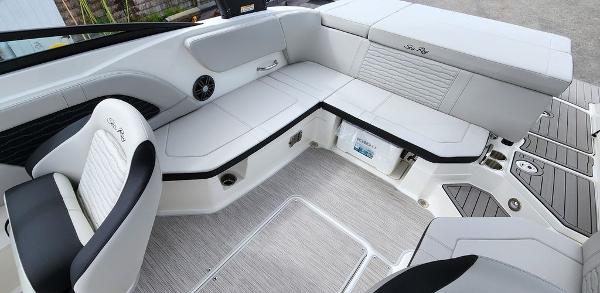 Slide: The Image of Interior seating of 2024 Sea Ray 230 SPX boat with white and black upholstery. - 10