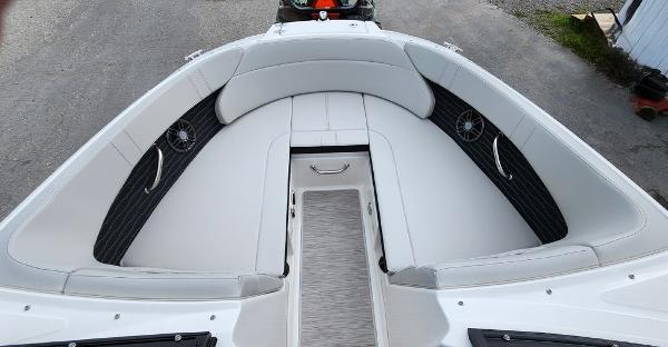 Slide: The Image of 2024 Sea Ray 230 SPX boat with spacious bow seating and modern interior design. - 4