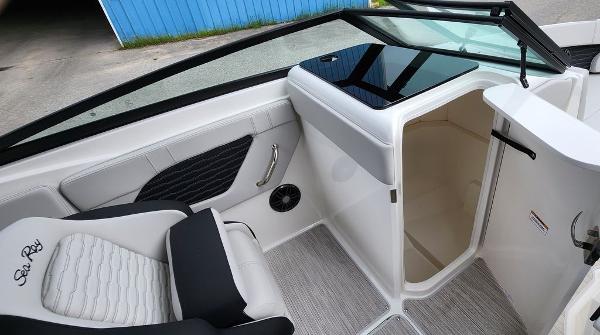 Slide: The Image of 2024 Sea Ray 230 SPX boat interior with seating and storage compartment. - 5