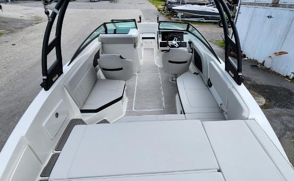Slide: The Image of 2024 Sea Ray 230 SPX boat interior with spacious seating and modern design. - 7