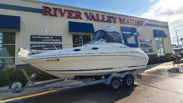 Slide: The Image of 1996 Sea Ray 240 Sundancer boat on trailer at River Valley Marine dealership. - 1