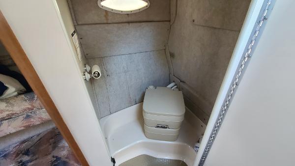 Slide: The Image of Compact bathroom in 1996 Sea Ray 240 Sundancer boat with portable toilet. - 19