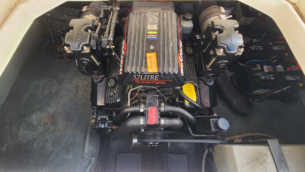 Slide: The Image of 1996 Sea Ray 240 Sundancer engine compartment with 5.7L V8 MerCruiser engine. - 21