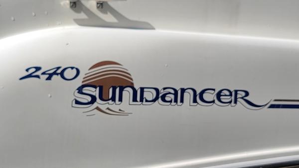 Slide: The Image of 1996 Sea Ray 240 Sundancer boat model name and logo - 23