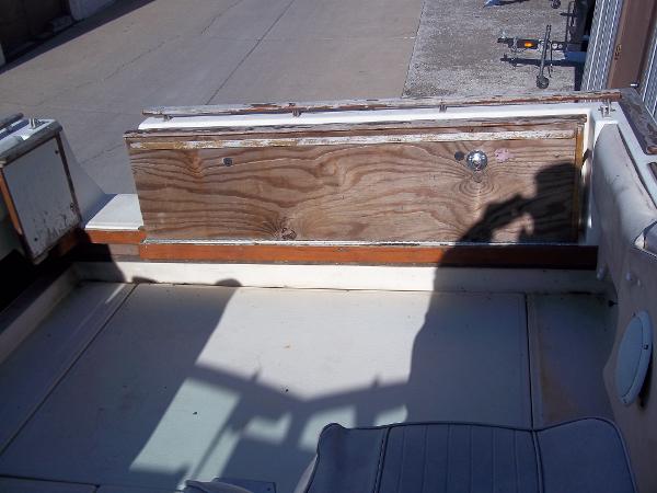Slide: The Image of 1984 Sea Ray SRV 260 Sundancer boat interior with wooden panel and seating. - 14
