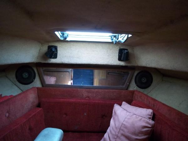 Slide: The Image of Interior cabin of 1984 Sea Ray SRV 260 Sundancer with red upholstery and skylight. - 17