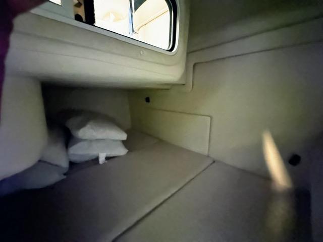 Slide: The Image of Interior cabin of a 2001 Sea Ray 260 Sundancer boat with cushions and pillows. - 8