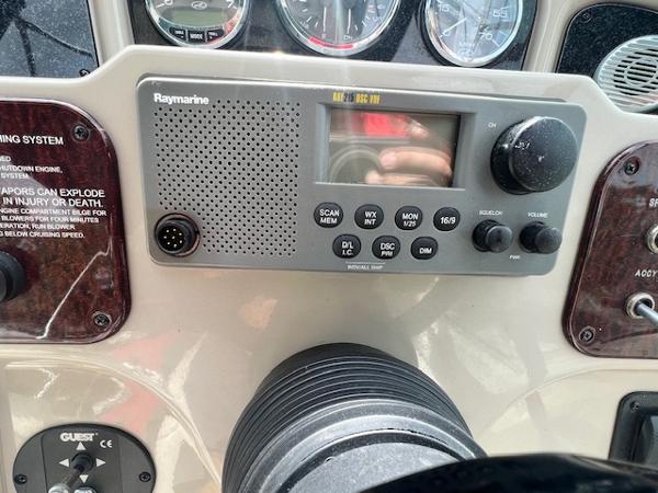 Slide: The Image of Close-up of Raymarine marine radio on 2005 Sea Ray 260 Sundancer dashboard. - 18