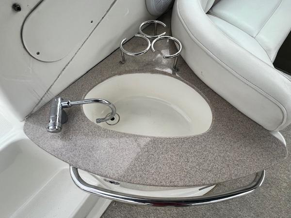 Slide: The Image of 2005 Sea Ray 260 Sundancer boat sink and cup holders - 8