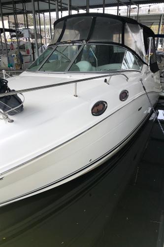 Slide: The Image of 2007 Sea Ray 260 Sundancer boat docked in a marina. - 0