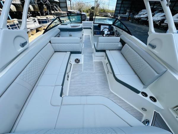 Slide: The Image of 2025 Sea Ray 270 SDX boat interior with spacious seating and modern design. - 12
