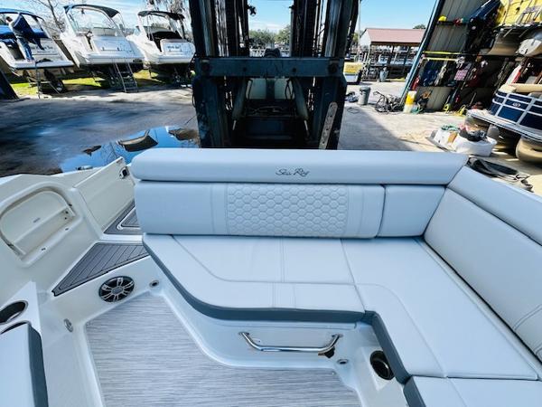 Slide: The Image of 2025 Sea Ray 270 SDX boat interior with white seating and modern design. - 14