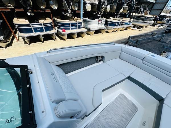 Slide: The Image of 2025 Sea Ray 270 SDX boat interior with spacious seating and modern design. - 25