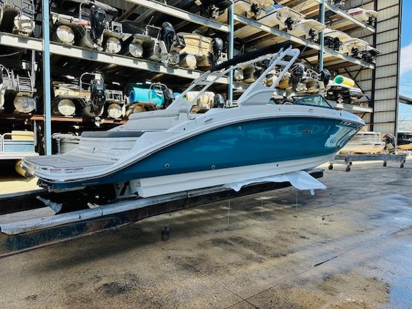 Slide: The Image of 2025 Sea Ray 270 SDX boat in storage facility, side view. - 6
