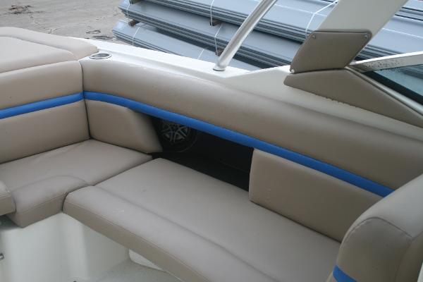 Slide: The Image of 2014 Sea Ray 270 SLX boat interior seating with beige and blue upholstery. - 12