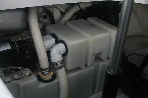 Slide: The Image of Engine compartment of a 2014 Sea Ray 270 SLX boat showing hoses and components. - 21