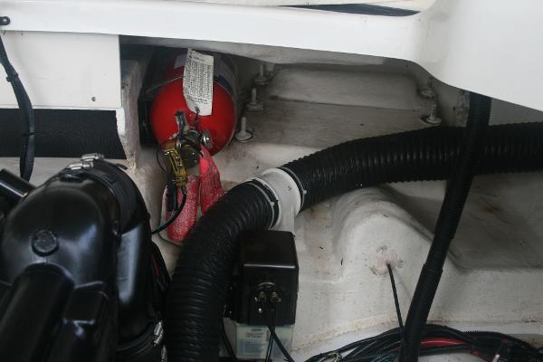 Slide: The Image of Engine compartment of a 2014 Sea Ray 270 SLX boat with fire extinguisher. - 26