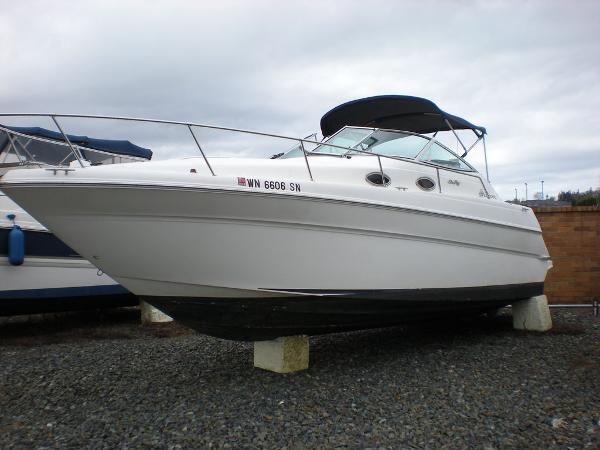 Slide: The Image of 1998 Sea Ray Sundancer 270 boat on dry dock, side view. - 0