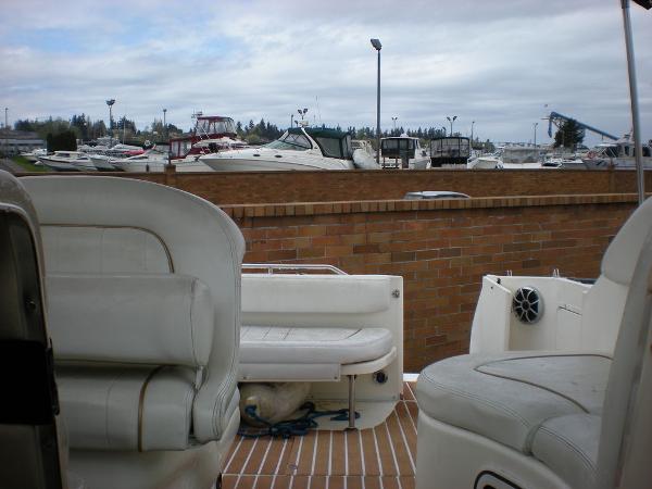 Slide: The Image of 1998 Sea Ray Sundancer 270 interior with marina view in the background. - 7