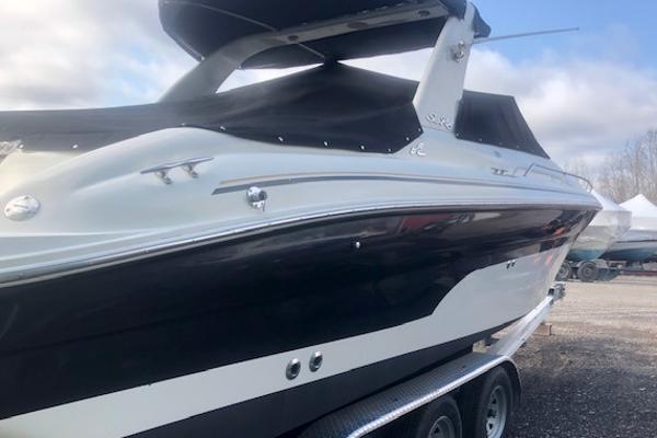 Slide: The Image of 2000 Sea Ray 280 Bow Rider boat on trailer, covered and ready for transport. - 4