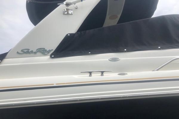Slide: The Image of 2000 Sea Ray 280 Bow Rider boat with black cover and logo visible. - 5