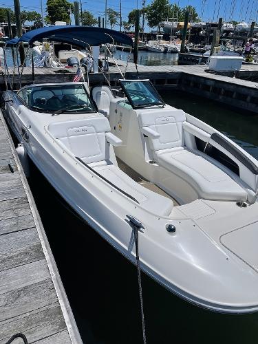 Slide: The Image of 2014 Sea Ray 280 Sundeck boat docked at a marina. - 1