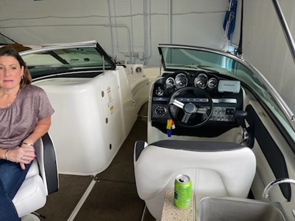 Slide: The Image of 2014 Sea Ray 280 Sundeck interior with dashboard and seating area. - 12