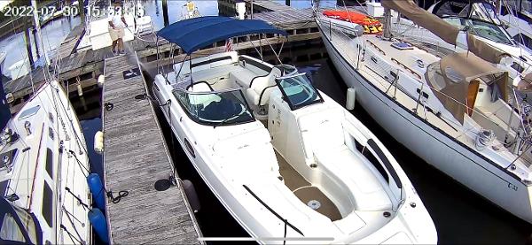 Slide: The Image of 2014 Sea Ray 280 Sundeck docked at a marina with other boats. - 3