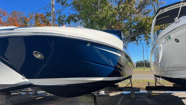 Slide: The Image of 2014 Sea Ray 280 Sundeck boat on display, side view. - 7