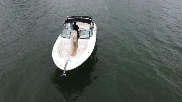 Slide: The Image of 2008 Sea Ray 290 SLX boat on calm water, aerial view. - 2