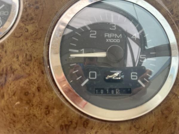 Slide: The Image of Close-up of 1999 Sea Ray 310 DA RPM gauge showing 1018.5 hours. - 8