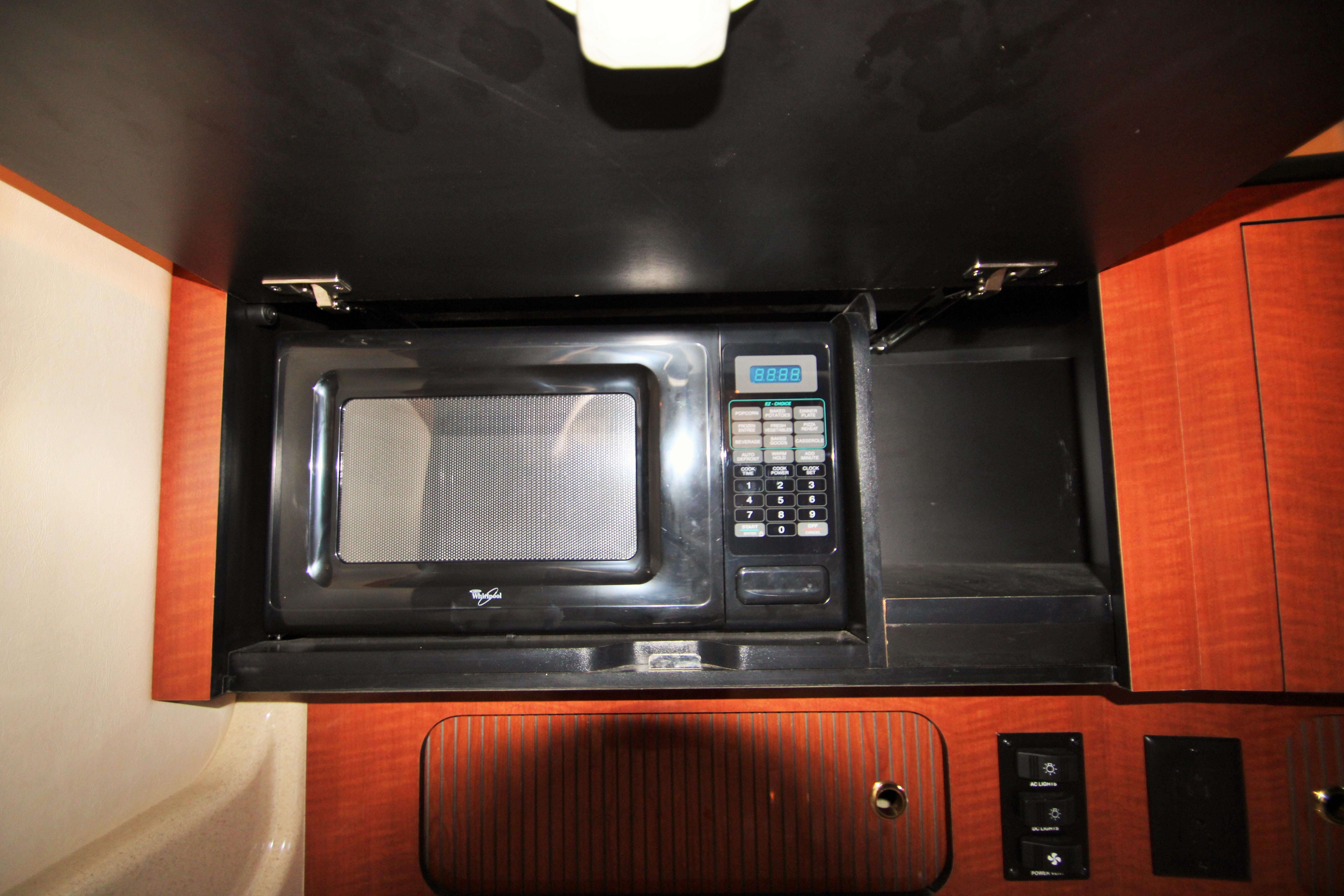 Slide: The Image of Microwave in 2003 Sea Ray 320 Sundancer yacht kitchen cabinet. - 10