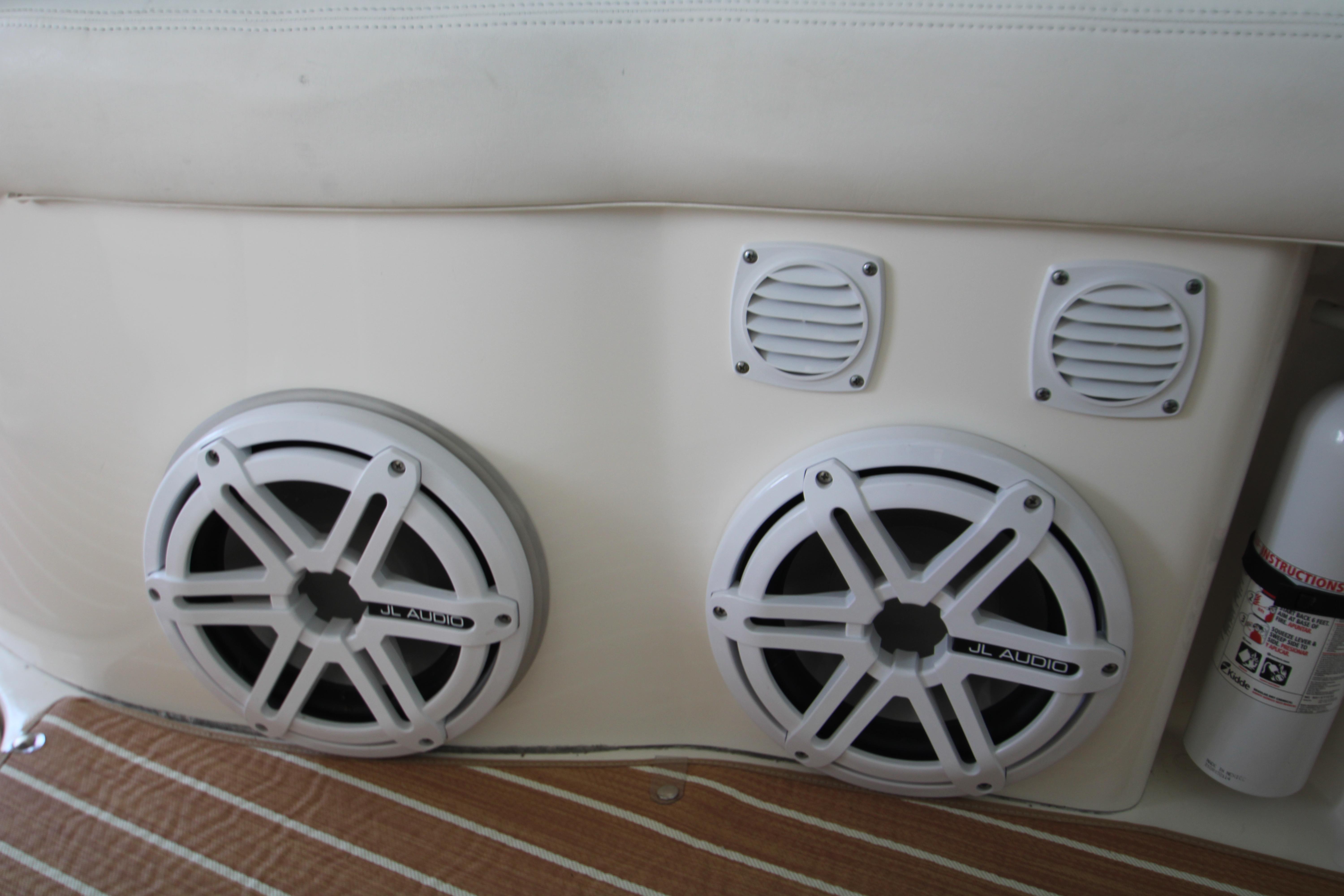 Slide: The Image of Speakers and fire extinguisher on 2003 Sea Ray 320 Sundancer boat interior. - 32