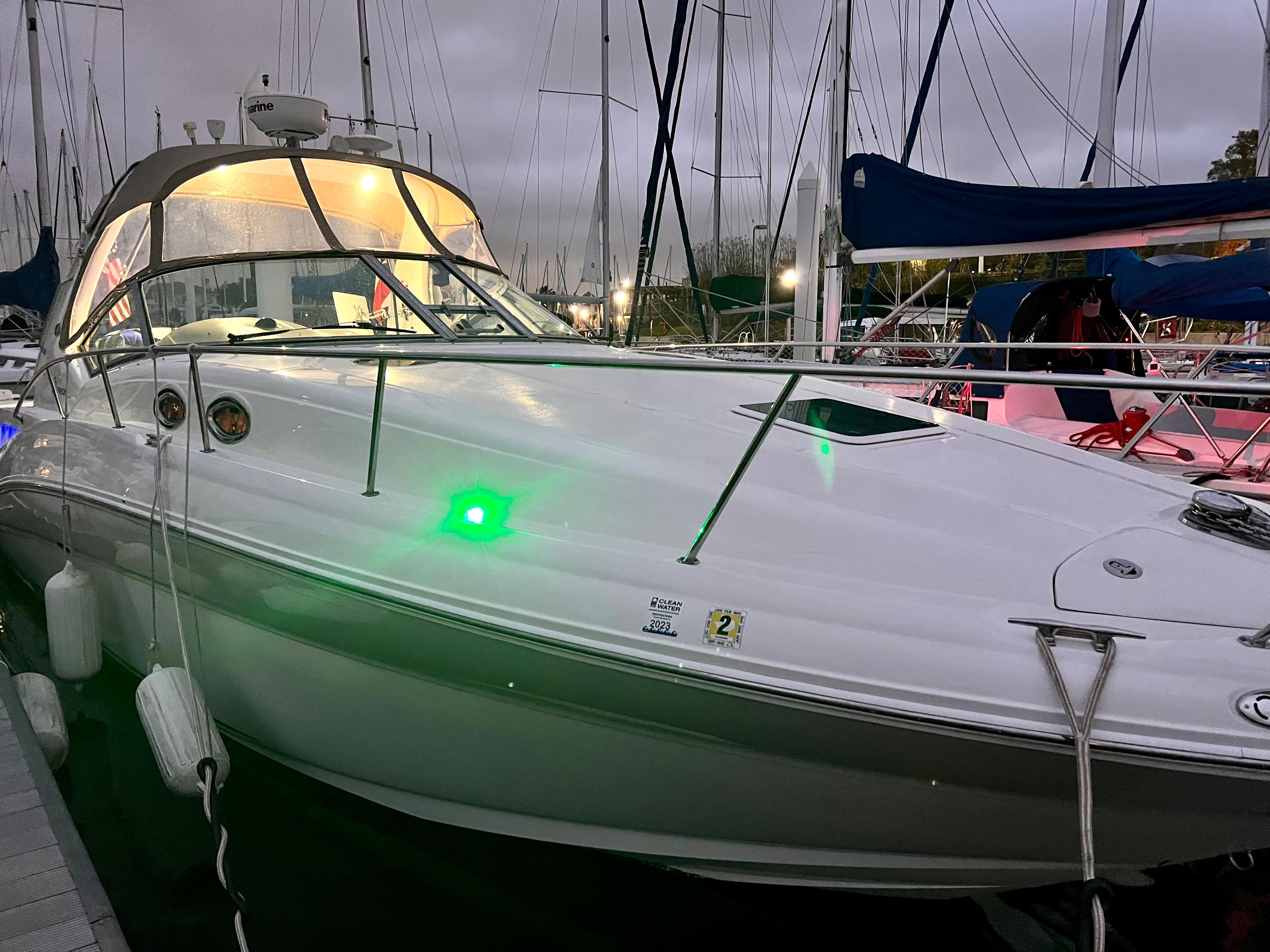 Slide: The Image of 2004 Sea Ray 320 Sundancer docked at marina during evening. - 10